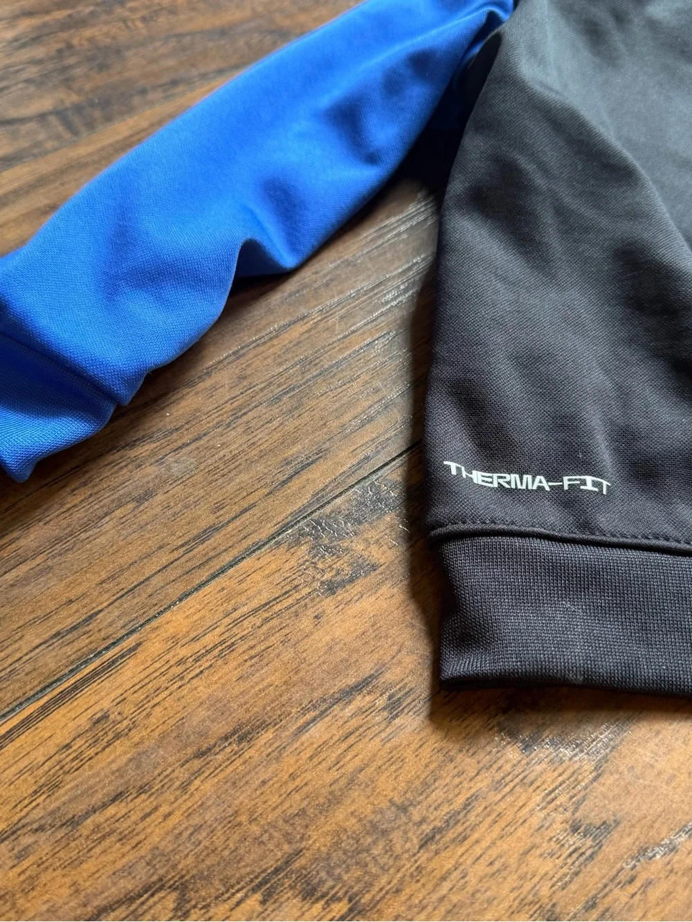 Nike Black Hoodie with Blue Sleeves and White Logo